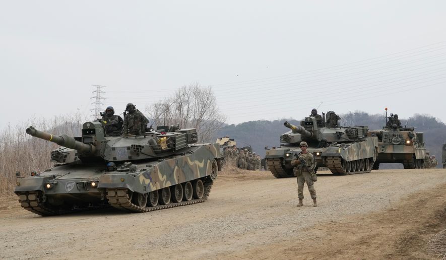 South Korean army's K1A2 tanks move during a joint river-crossing exercise between South Korea and the United States as a part of the Freedom Shield military exercise in Yeoncheon, South Korea, Saturday, March 14, 2026. (AP Photo/Ahn Young-joon)