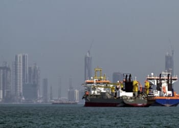 Commercial vessels are pictured offshore in Dubai on March 11, 2026.