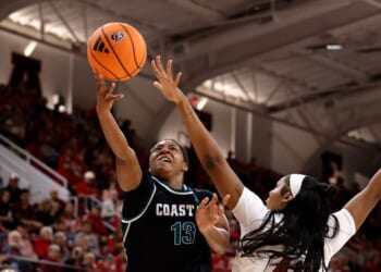 Tracey Hueston of the Coastal Carolina Chanticleers puts up a shot against Mallory Collier of the NC State Wolfpack in the second half at Reynolds Coliseum on Nov. 19, 2025, in Raleigh, North Carolina.