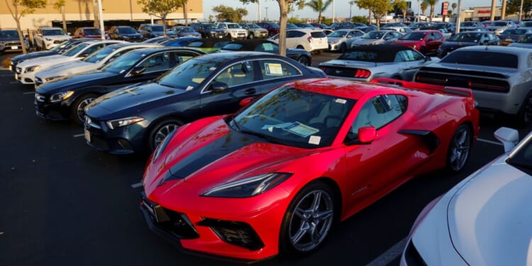 Vehicles for sale are parked in a lot at a CarMax dealership on April 24, 2025, in San Diego, California.