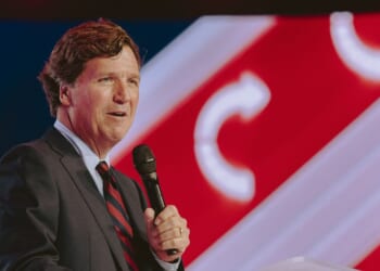 Tucker Carlson speaks at Turning Point USA's annual AmericaFest conference, in remembrance of late conservative political activist Charlie Kirk, in Phoenix, Arizona, on Dec. 18, 2025.
