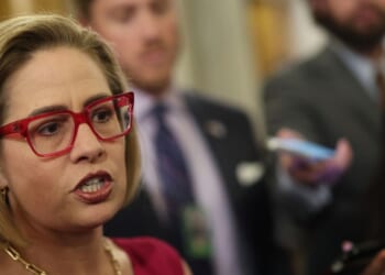 Now-former Sen. Kyrsten Sinema speaks to reporters at the U.S. Capitol on Feb. 5, 2024, in Washington, D.C.