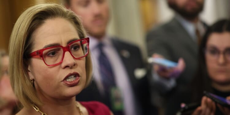 Now-former Sen. Kyrsten Sinema speaks to reporters at the U.S. Capitol on Feb. 5, 2024, in Washington, D.C.