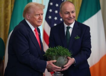 Irish Taoiseach (Prime Minister) Micheál Martin presents President Donald Trump with a bowl of clover during a 2025 St. Patrick’s Day event in the East Room of the White House in Washington, DC. Martin is once again scheduled to visit Trump at the White House next week.