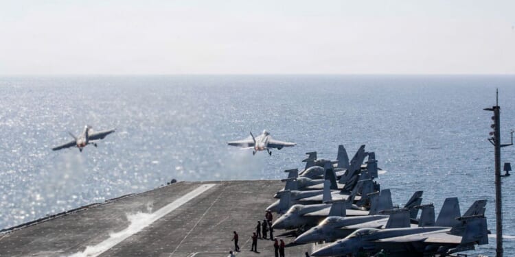 In this handout photo provided by the U.S. Navy, Two F/A-18 Super Hornets launch from the flight deck of Nimitz-class aircraft carrier USS Abraham Lincoln (CVN 72) in support of Operation Epic Fury on March 3, 2026, in the Mediterranean Sea.