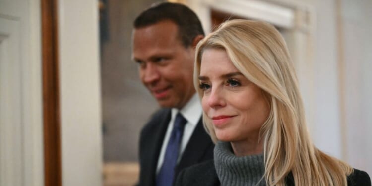 Attorney General Pam Bondi walks in with former professional baseball player Alex Rodriguez to attend an event for Inter Miami CF, winners of the 2025 Major League Soccer Cup, in the East Room of the White House in Washington, D.C., on March 5, 2026.