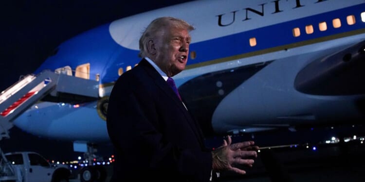 President Donald Trump speaks to the news media Wednesday in front of Air Force One at Joint Base Andrews, Maryland.