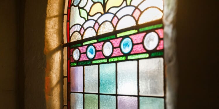 A stained-glass window is seen in an English church in a file photo dated March 18, 2020.