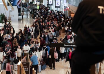 Huge lines of passengers clog New York's LaGuardia airport on Sunday,