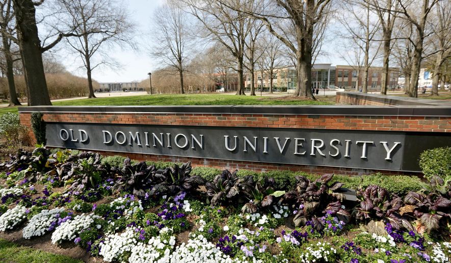 Flowers bloom in front of Old Dominion University in Norfolk, Va., on March 12, 2020. (Stephen M. Katz/The Virginian-Pilot via AP) ** FILE **