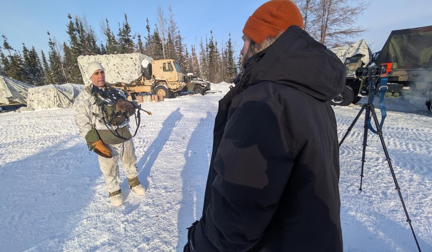 John T. Seward interviews Col. Chris Brawley, the commander of 1st Brigade, 11th Airborne Division known as the "Arctic Wolves." Col. Brawley led his unit through the Arctic training exercise in Alaska. (U.S. Army photo)