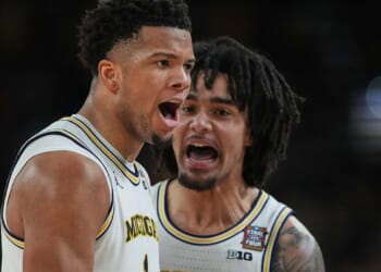 Michigan muscles its way to program’s 2nd national title, beating stubborn UConn