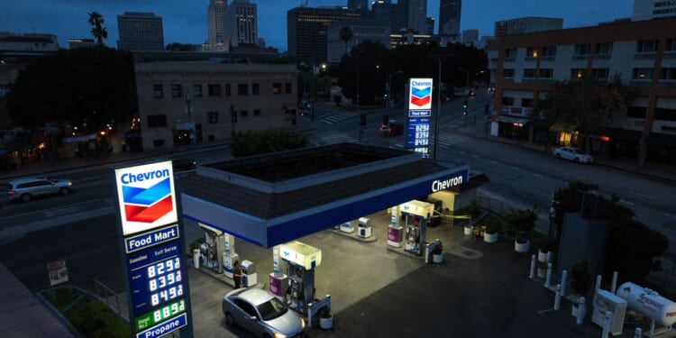 Chevron exec says that with high gas prices, Americans should drive less