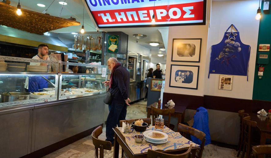A man orders a traditional tripe soup known as "patsas" in Greek and "iskembe" in Turkish, at Epirus restaurant in central Athens, on Friday, April 3, 2026. (AP Photo/Petros Giannakouris)