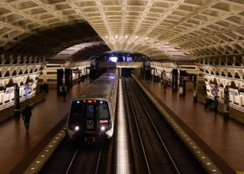A work vehicle hits a stopped Washington Metro train, injuring 11
