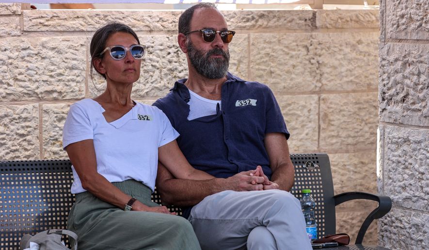 FILE - Jonathan Polin and Rachel Goldberg, parents of Israeli-American hostage Hersh Goldberg-Polin, who was killed in Hamas captivity in the Gaza Strip, attend their son's funeral in Jerusalem, Monday, Sept. 2, 2024. (Gil Cohen-Magen/Pool via AP, File)