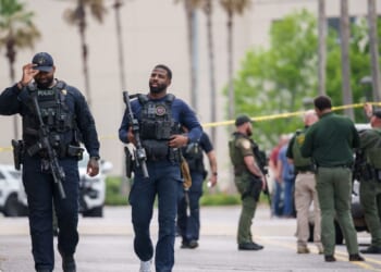 Authorities arrest one person and search for another, following deadly shooting at mall in Louisiana