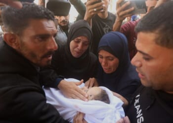Palestinians hold funerals for pregnant woman and her children killed in Israeli strikes