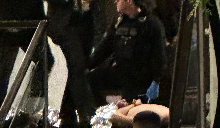 Members of law enforcement respond during the White House Correspondents Dinner, Saturday, April 25, 2026, in Washington. (AP Photo/Alex Brandon)