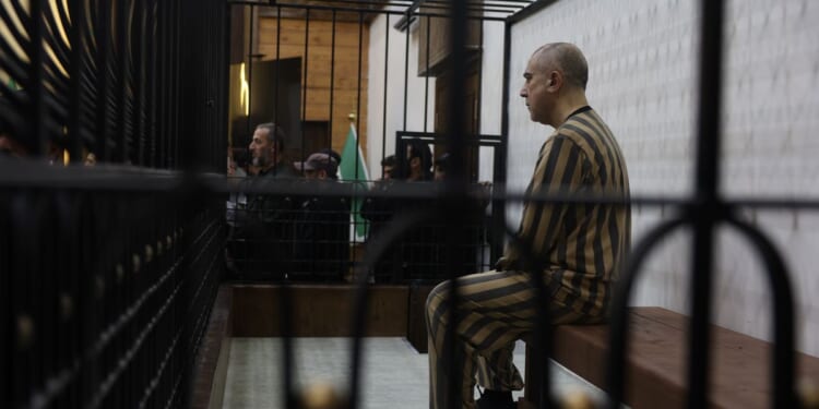 Syria’s first public trial of Assad-era officials opens in Damascus