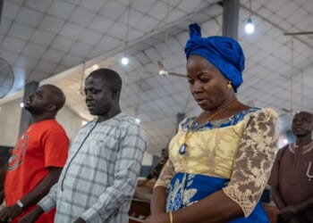 Roman Catholics pray at Saint Michael's Cathedral during the Sunday service in Minna on Nov. 30, 2025.