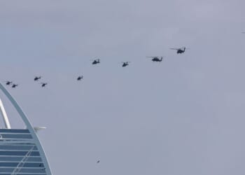 United Arab Emirates army helicopters fly past Burj al Arab hotel in Dubai on Jan. 16, 2026.