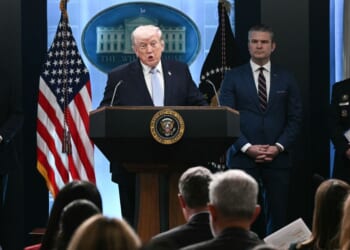 President Donald Trump stands at a podium next to CIA Director John Ratcliffe, US Secretary of Defense Pete Hegseth, and Chairman of the Joint Chiefs of Staff General Dan Caine as he speaks about the Iran conflict in the James S. Brady Press Briefing Room of the White House in Washington, DC on April 6, 2026.