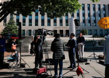 Members of the news media set up outside the E. Barrett Prettyman United States Court House Monday in Washington, D.C., where the alleged White House Correspondents' Dinner gunman, Cole Allen, was expected to be arraigned.