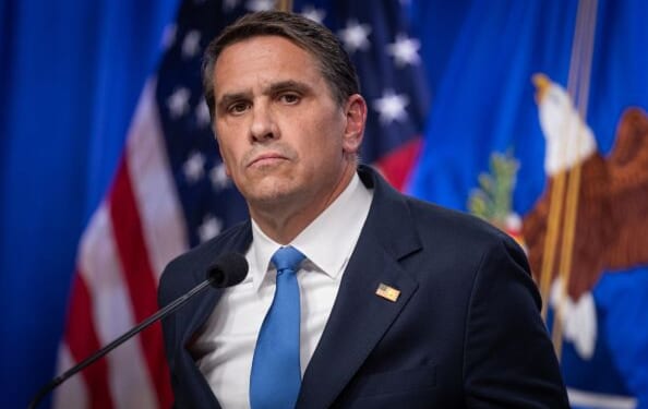 Acting Attorney General Blanche stands at a podium in the Department of Justice press room on April 21, 2026.