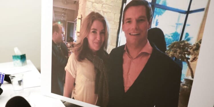 A picture showing Lonna Drewes and former Rep. Eric Swalwell, a Democrat from California, is shown during a press conference where she described her claims about sexual misconduct by Swalwell in Beverly Hills, California, on April 14, 2026.