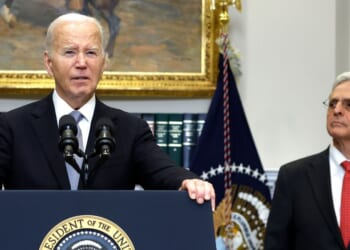 Then-President Joe Biden is flanked by Attorney General Merrick Garland in a July 2024 appearance. A new Department of Justice report calls the Biden administration's hostile actions against pro-lifers "shameful."