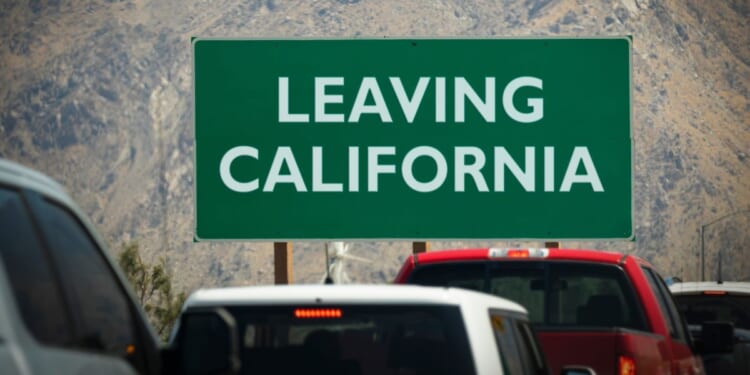 A leaving California sign at the border of the Golden State.