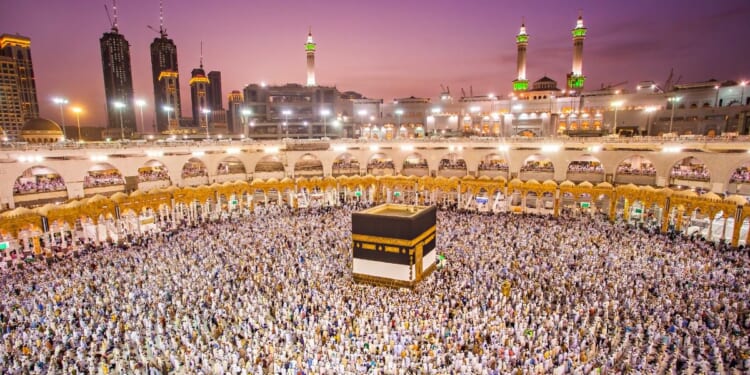 Muslim pilgrims from all around the world doing tawaf, praying around the Kaabah in Mecca, Saudi Arabia.