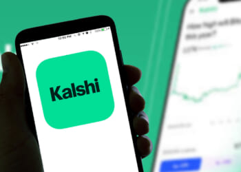 The Kalshi online betting app logo is seen displayed on a smartphone screen.
