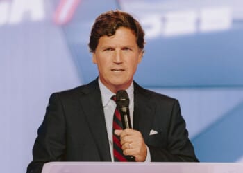 Conservative political commentator and podcast host Tucker Carlson speaks at Turning Point USA's annual AmericaFest conference, in remembrance of late right-wing political activist Charlie Kirk, in Phoenix, Arizona, on Dec. 18, 2025.