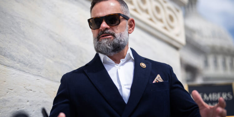 Cory Mills, R-Fla., talks with reporters on the House steps of the U.S. Capitol.