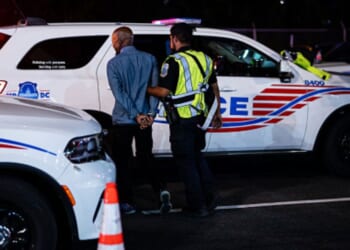 Individual gets arrested by Metropolitan Police in Washington, D.C. on August 28, 2025.