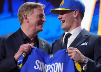 Alabama quarterback Ty Simpson poses with NFL Commissioner Roger Goodell after being chosen by the Los Angeles Rams with the 13th overall pick during the first round of the NFL football draft, Thursday in Pittsburgh, Pennsylvania. Due to "embarrassing" blunders, viewers on social media knew of Simpson's pick long before those watching ESPN.