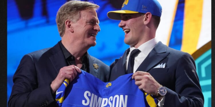 Alabama quarterback Ty Simpson poses with NFL Commissioner Roger Goodell after being chosen by the Los Angeles Rams with the 13th overall pick during the first round of the NFL football draft, Thursday in Pittsburgh, Pennsylvania. Due to "embarrassing" blunders, viewers on social media knew of Simpson's pick long before those watching ESPN.
