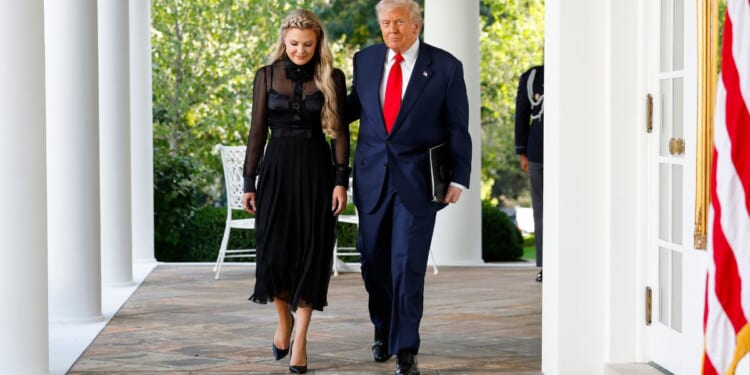 Erika Kirk, wife of late conservative activist Charlie Kirk, is pictured with President Donald Trump at the White House in October.