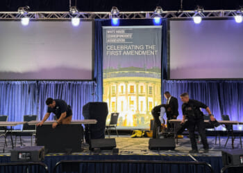 Staff clear out the White House Correspondents’ Dinner stage on April 25, 2026.