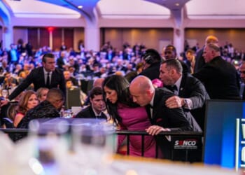 Attendees including White House Deputy Chief of Staff for Policy Stephen Miller are hustled out of the Washington Hilton ballroom on April 25, 2026.