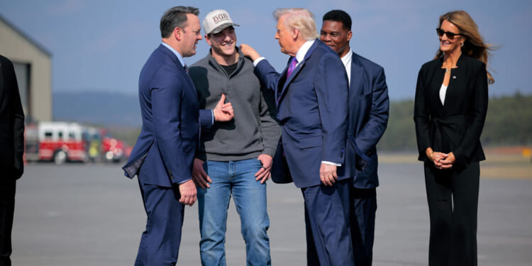 Burt Jones, President Donald Trump at Russell Regional Airport on February 19, 2026 in Rome, Georgia.
