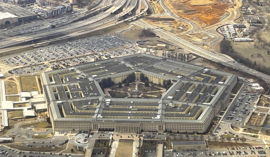 The Pentagon is seen in this aerial view through an airplane window in Washington on Thursday, Feb. 20, 2025. (AP Photo/Pablo Martinez Monsivais) ** FILE **