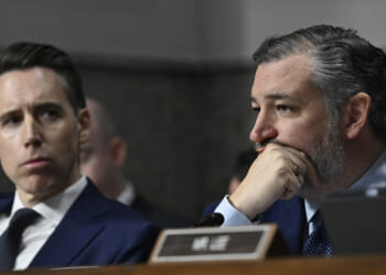 Hawley sits next to Cruz