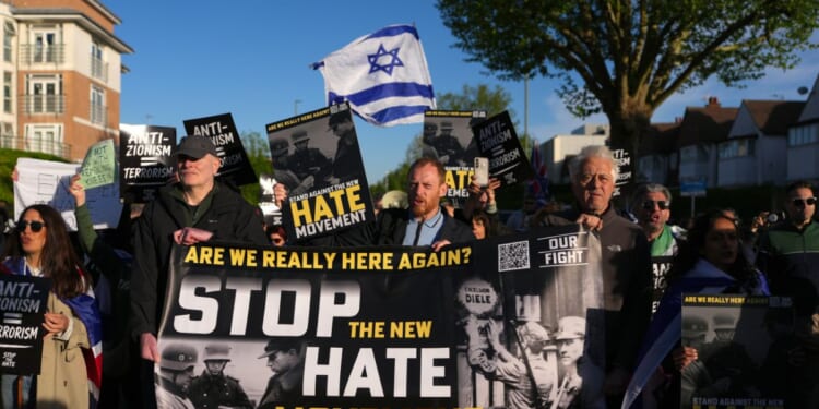 People participate in an "Anti-Zionism = Terrorism" protest, organized by the pressure group Stop the Hate in Golders Green following the stabbing of two people earlier on April 29, 2026, in the Golders Green area of London, England.