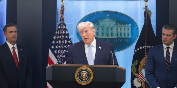 President Donald Trump speaks alongside Central Intelligence Agency Director John Ratcliffe and Secretary of War Pete Hegseth during a news conference in James S. Brady Press Briefing Room of the White House on April 6, 2026, in Washington, D.C.