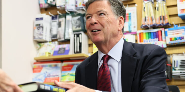 Author James Comey, former FBI Director, signs copies of his books for fans at the Barnes & Noble Upper West Side on May 19, 2025 in New York City. Comey sat with Esposito to discuss his career and new book "FDR DRIVE," the third of a series of fictional crime novels featuring attorney Nora Carleton. (Photo by Michael M. Santiago/Getty Images)
