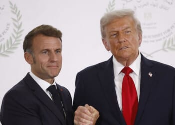 French President Emmanuel Macron and President Donald Trump shake hands during the greetings ceremony at the Gaza Peace Summit in Sharm El-Sheikh, on Oct. 13, 2025.