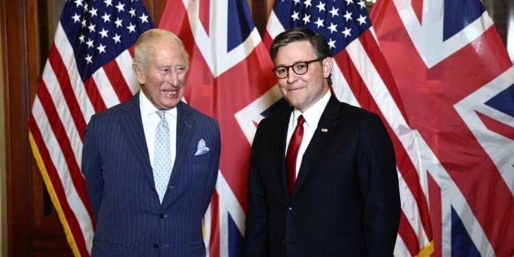 King Charles and Mike Johnson standing